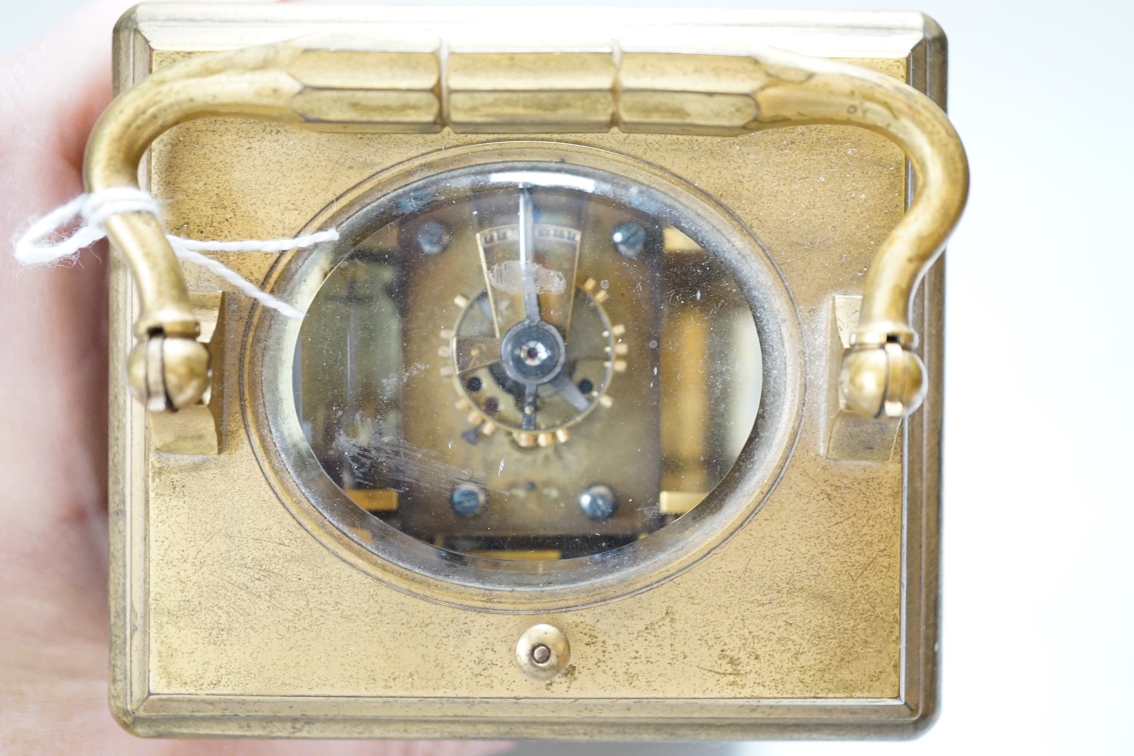 A late 19th century French ormolu, hour repeating carriage clock, with gorge case and enamelled Roman dial, 9.5cm wide, 8.5cm deep, 15cm high